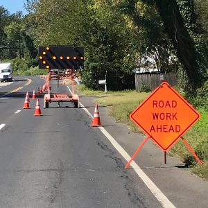 Road work ahead sign and road arrow