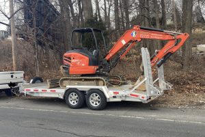 A backhoe on a trailer